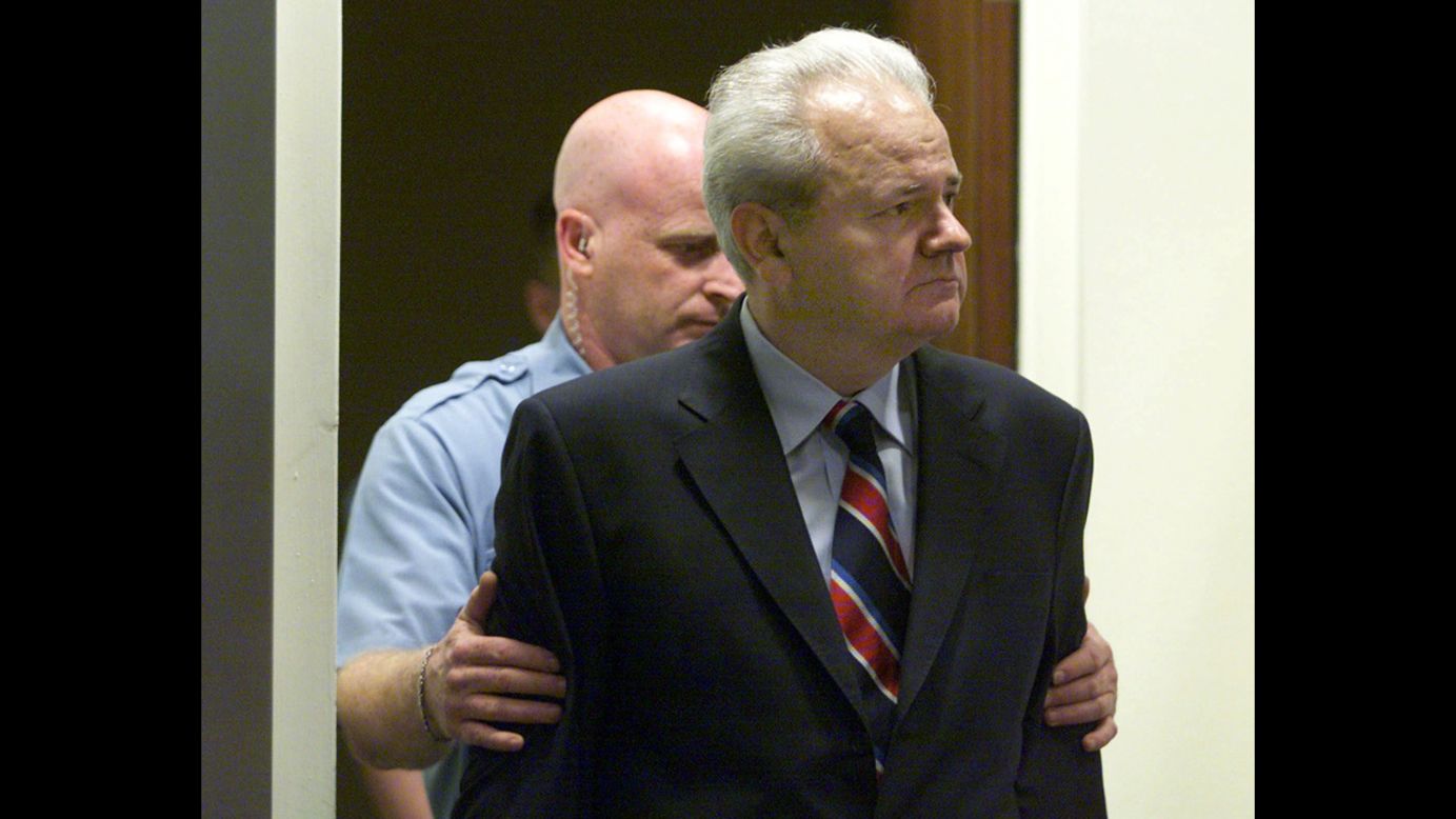 Former Yugoslav President Slobodan Milosevic enters the United Nations War Crimes Tribunal for the former Yugoslavia in The Hague in 2001. Milosevic was charged with war crimes, including genocide, and crimes against humanity in connection with the wars in Bosnia, Croatia, and Kosovo. His trial, which began in 2002, ended without a verdict when he was found dead in his prison cell in 2006. 