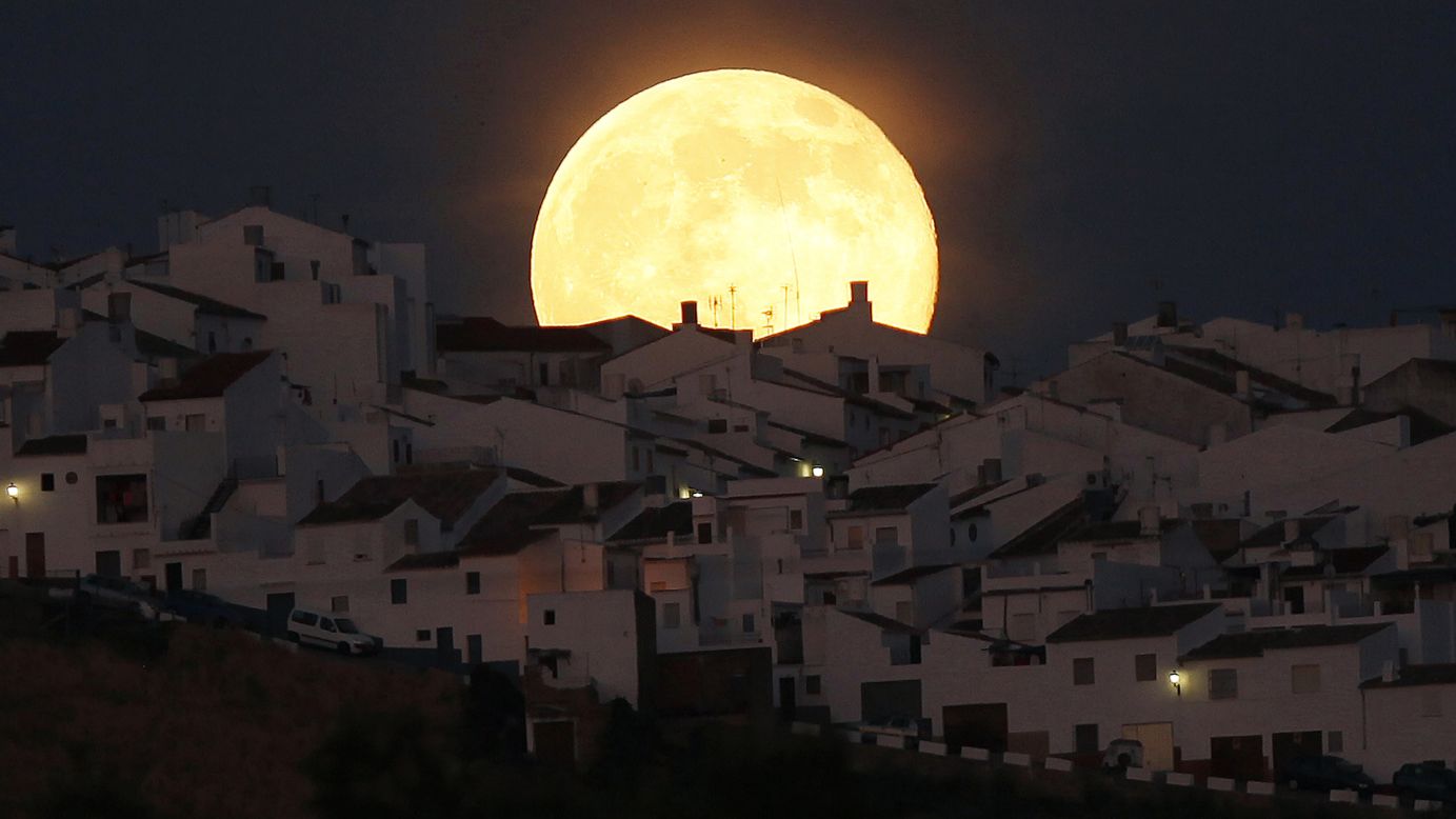 A "<a href="http://www.cnn.com/2014/07/12/world/gallery/supermoon-2014/index.html" target="_blank">supermoon</a>" rises over houses in Olvera, Spain, on Saturday, July 12. The phenomenon occurs when the moon becomes full on the same day as its perigee: the point in the moon's orbit when it's closest to Earth.