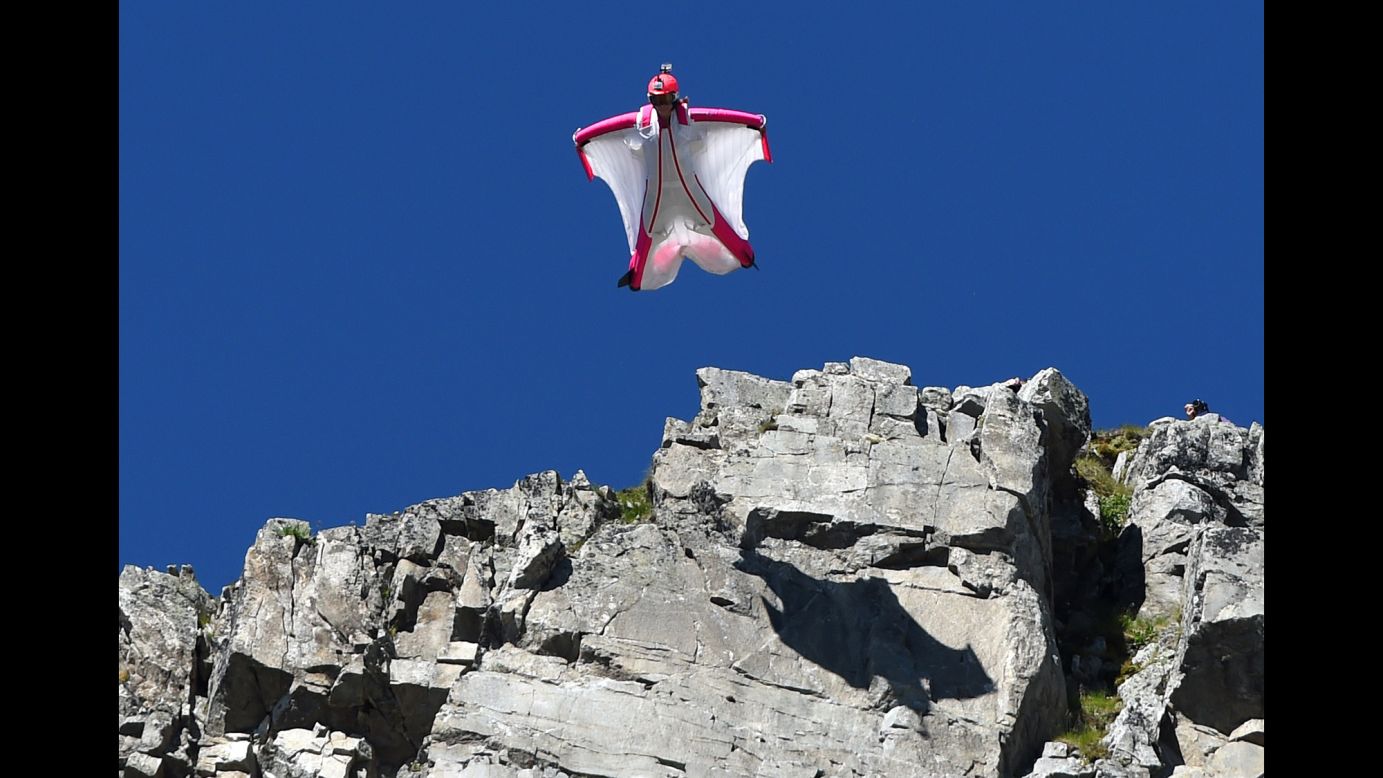 Switzerland's Geraldine Fasnacht jumps off Brevent Mountain in a wingsuit to fly over the French ski resort of Chamonix on Wednesday, July 16.