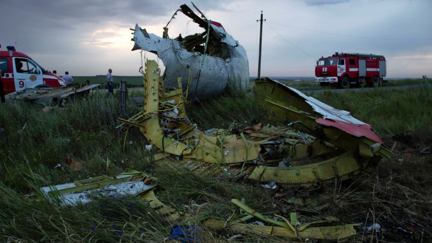 Fire engines arrive at the crash site of a passenger plane near the village of Hrabove, Ukraine, as the sun sets Thursday, July 17, 2014. Ukraine said a passenger plane carrying 295 people was shot down Thursday as it flew over the country, and both the government and the pro-Russia separatists fighting in the region denied any responsibility for downing the plane. (AP Photo/Dmitry Lovetsky)