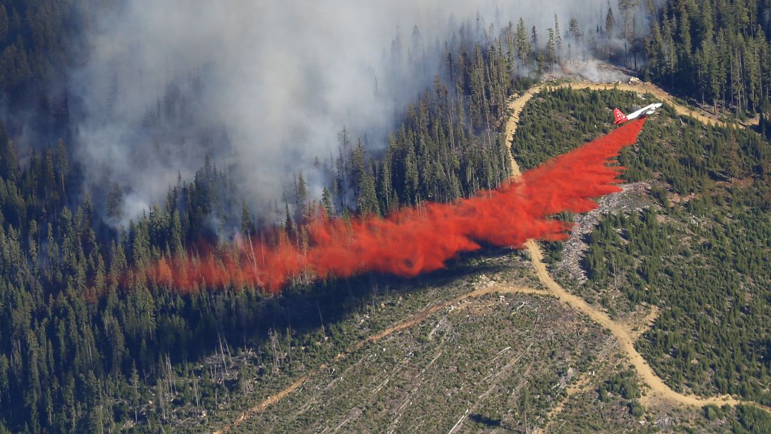 A plane drops fire retardant on a wildfire near Leavenworth, Washington, on Thursday, July 17.