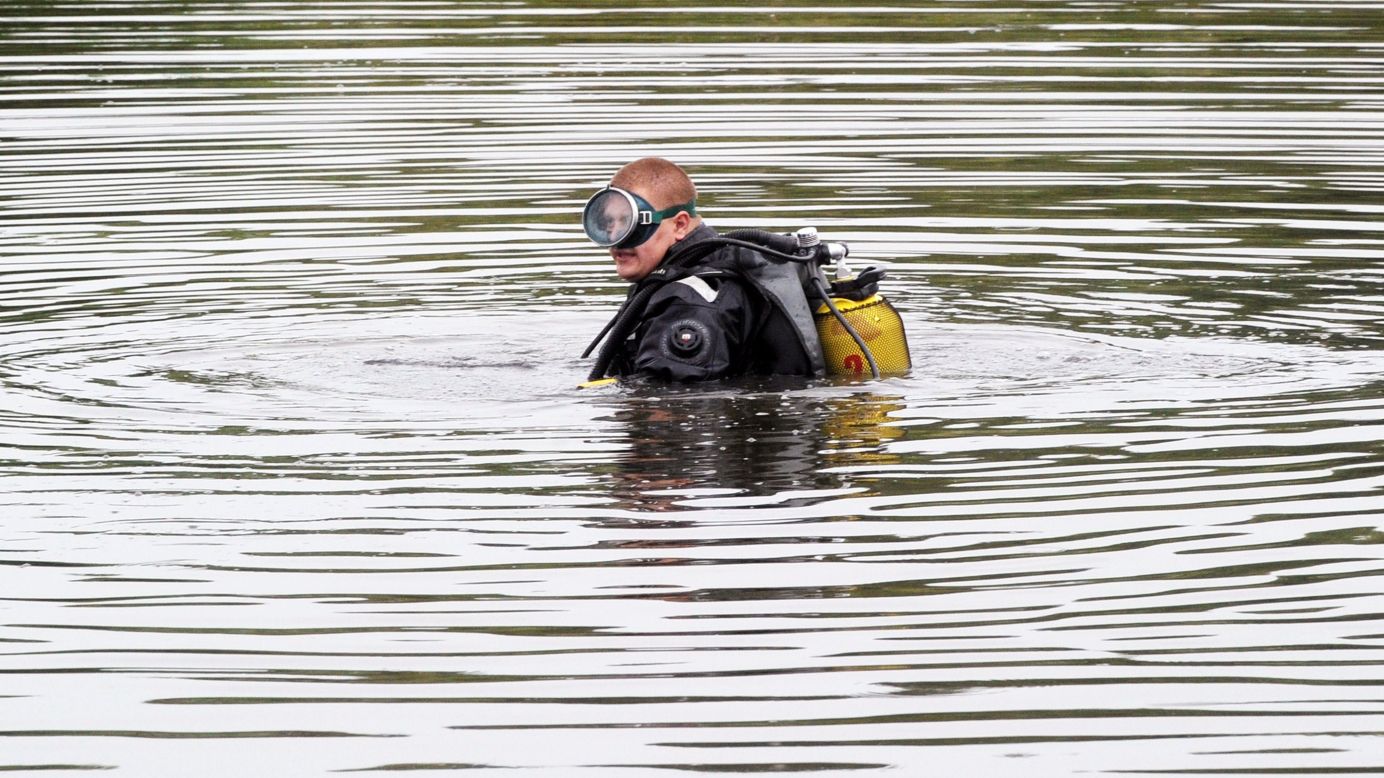A diver searches for the jet's flight data recorders on July 18, 2014.