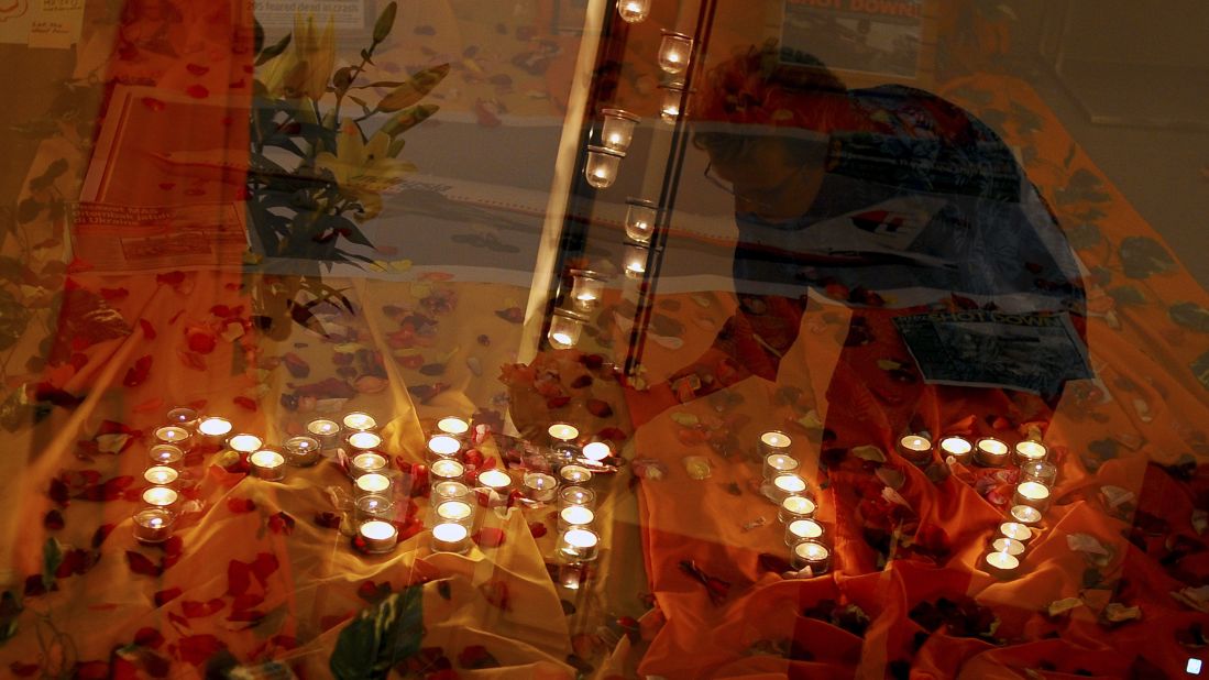 Candlelight prayers honor the victims at a church outside Kuala Lumpur on July 18. 