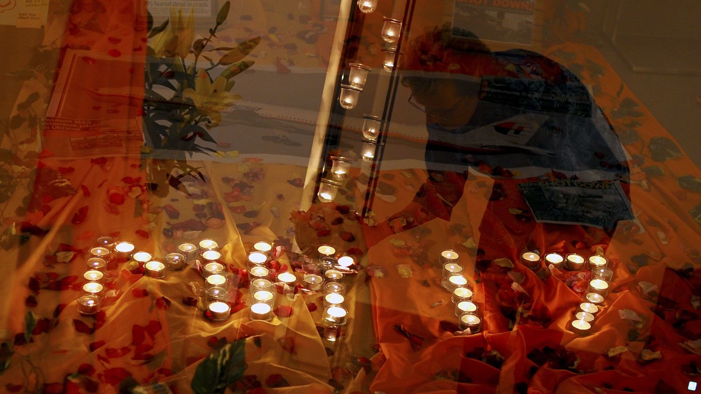 Candlelight prayers honor the victims at a church outside Kuala Lumpur on July 18. 