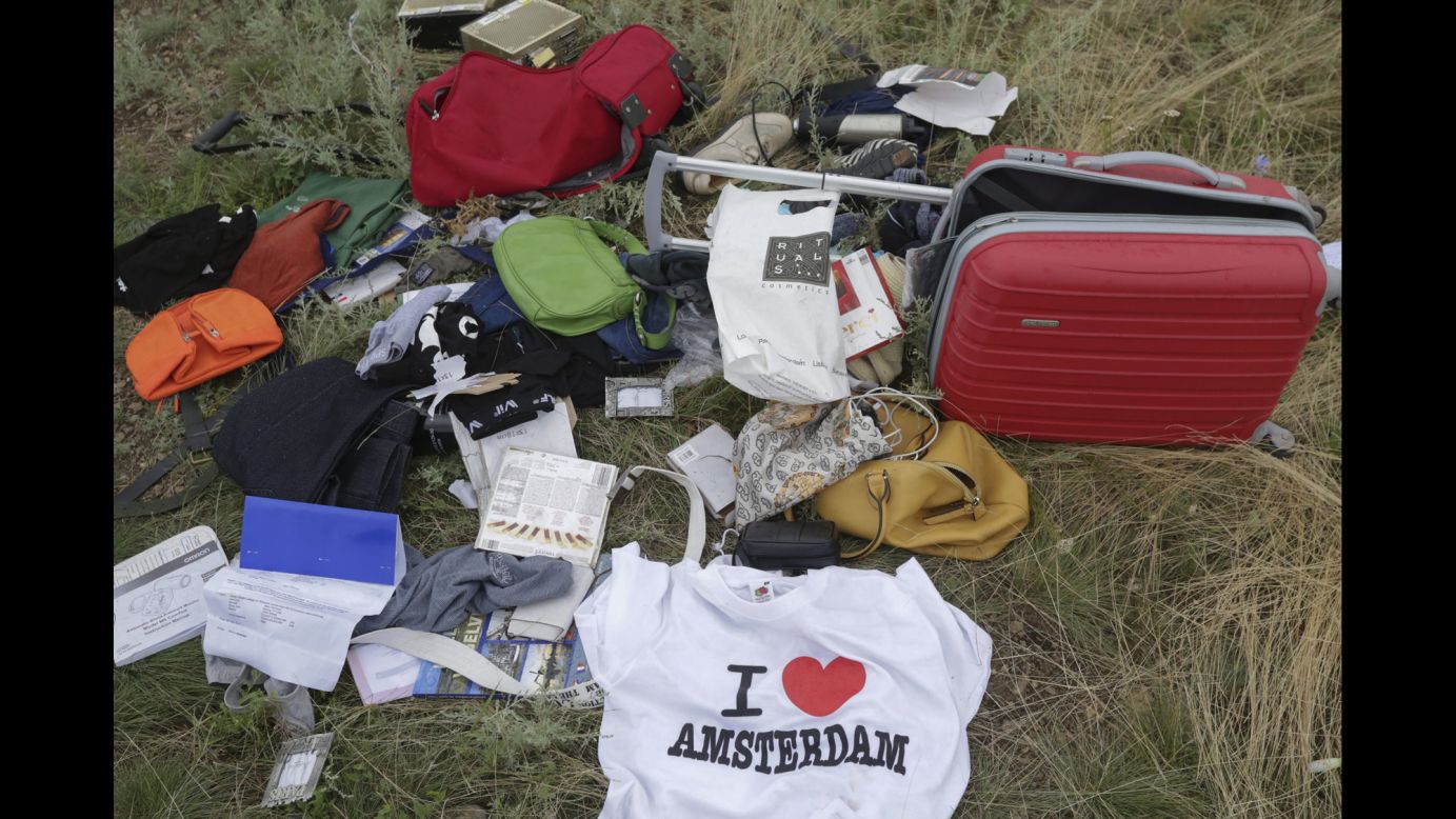 Books, bags, a tourist T-shirt. Ukraine's government said it had received reports of looting, and it urged relatives to cancel the victims' credit cards. But a CNN crew at the scene July 19 said it did not see any signs of looting.