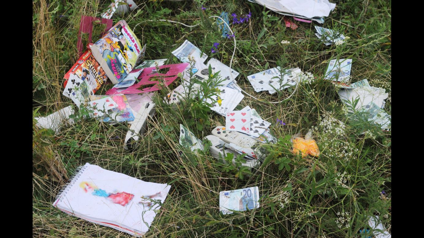 Playing cards and euros are seen at the crash site.