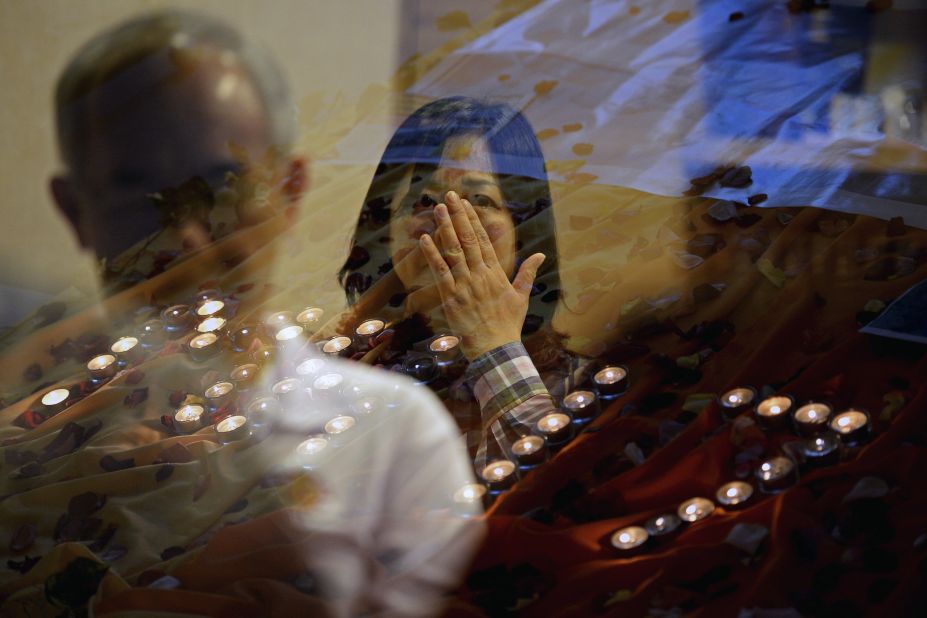 People pray for the victims of <a href="http://www.cnn.com/specials/world/mh17-specials-page/index.html" target="_blank">Malaysia Airlines Flight 17</a> at a church outside Kuala Lumpur on July 18. 