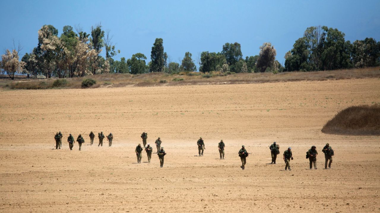 Israeli soldiers patrol near the Israel-Gaza border on July 18.