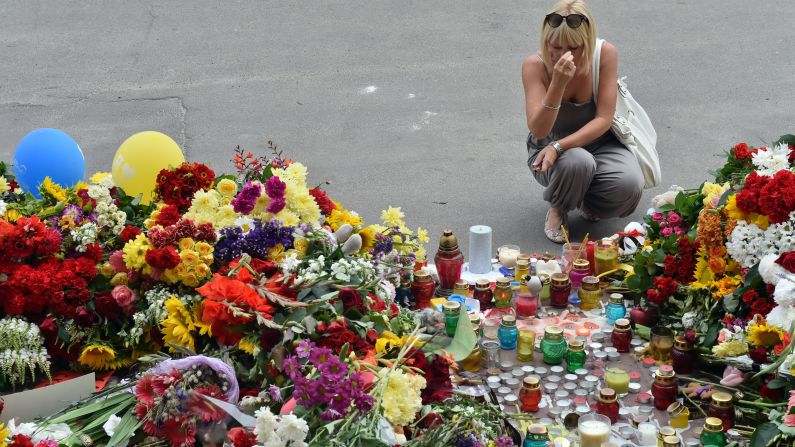 A woman grieves at a memorial in front of the Dutch Embassy in Kiev, Ukraine, on July 18.