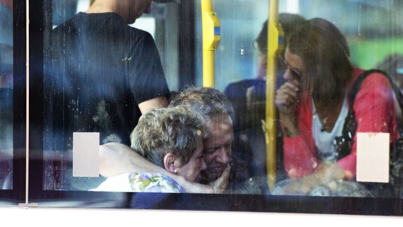Family members of victims leave Schiphol Airport on July 17 in Amsterdam.