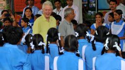 Former US president Bill Clinton smiles as he speaks with Indian schoolchildren during a visit in Sanganer on July 16.
