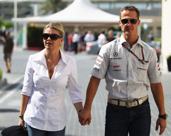 Corinna Schumacher, seen here with husband Michael in 2011, has striven to retain the family's privacy. She published a note of thanks to fans in the official program of the 2014 German Grand Prix.