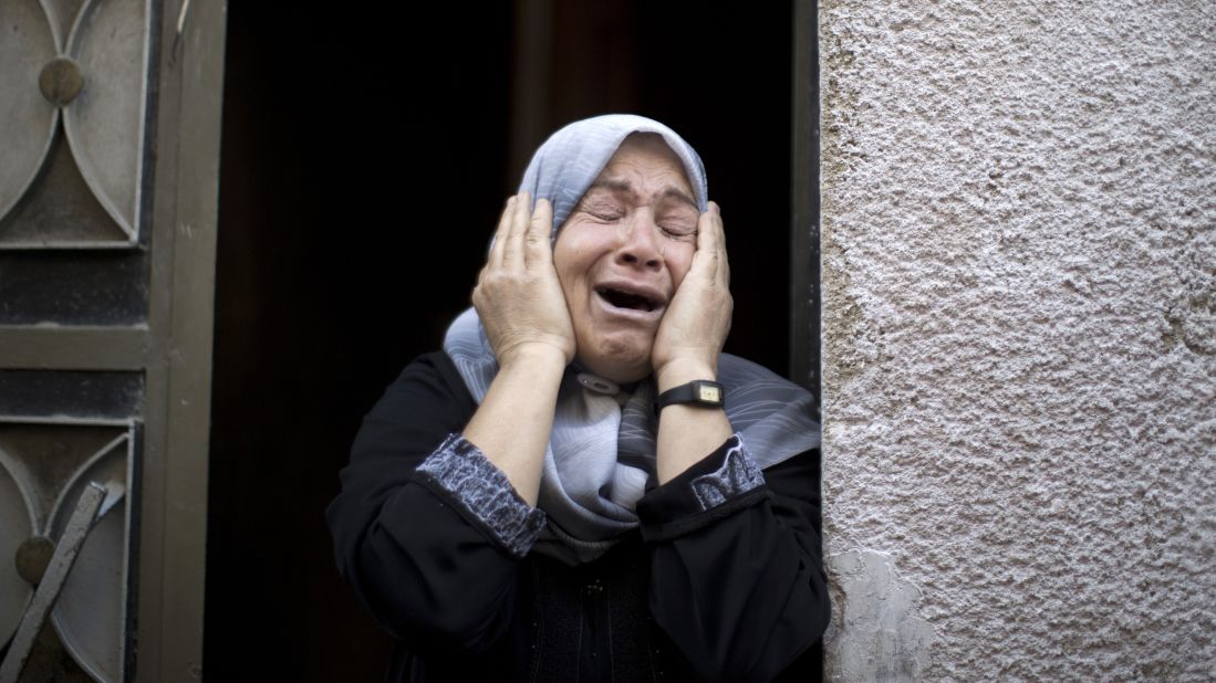 A relative mourns July 18 during the funeral of Rani Abu Tawila, a Palestinian who was killed in an Israeli attack on Gaza City. 