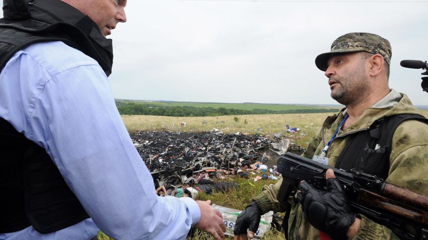 Alexander Hug, (L) Deputy Chief Monitor of the Organization for Cooperation and Security in Europe's (OSCE) Special Monitoring Mission to Ukraine, talks to a man wearing military fatigues at the site of the crash of a Malaysian airliner carrying 298 people from Amsterdam to Kuala Lumpur in Grabove, in rebel-held east Ukraine, on July 18, 2014. Members of the UN Security Council demanded a full, independent investigation into the apparent shooting down of a Malaysia Airlines jet over Ukraine. AFP PHOTO / DOMINIQUE FAGETDOMINIQUE FAGET/AFP/Getty Images