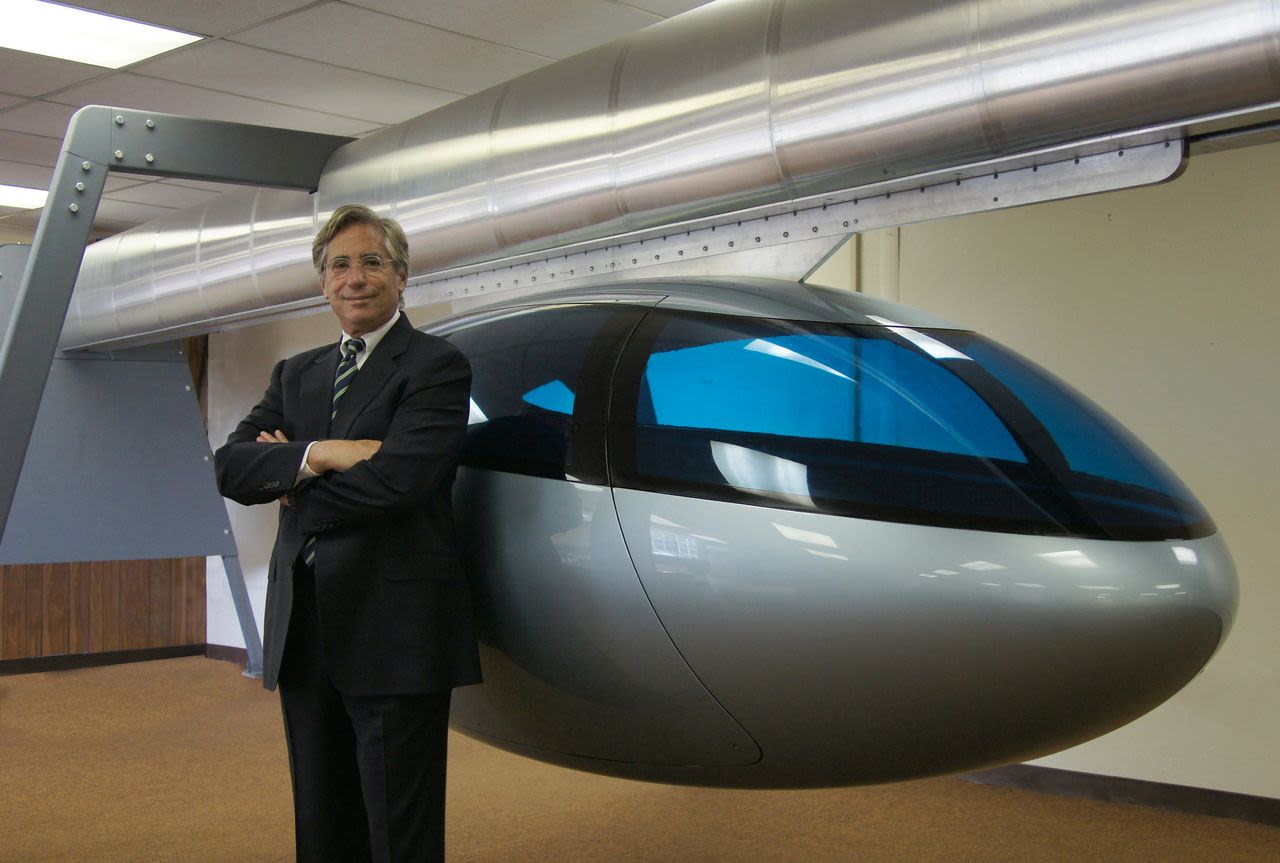 SkyTran CEO Jerry Sanders with a model pod. "Being stuck in traffic is just the most stress-inducing, soul-crushing part of society today," says Sanders. "We really want to make people's lives better and elevated, high-speed transportation is the answer."