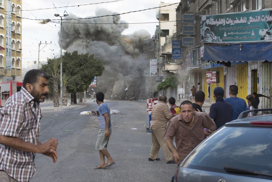 An explosion rocks a street in Gaza City on Friday, July 18.