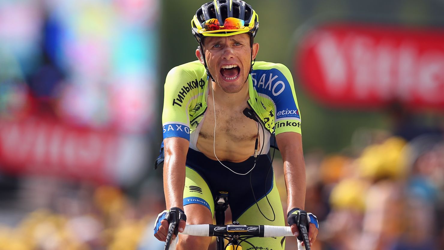 Polish rider Rafal Majka crosses the finish line first in stage 14 of the Tour de France.  