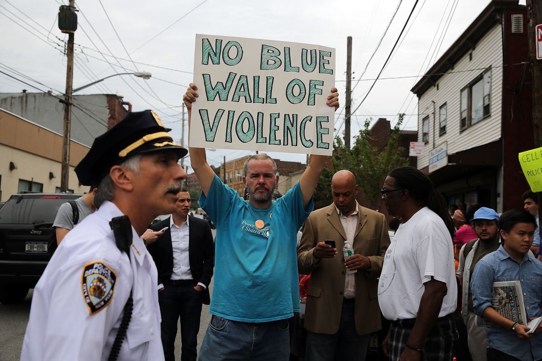 People participate in a demonstration against the death of Eric Garner after he was taken into police custody.