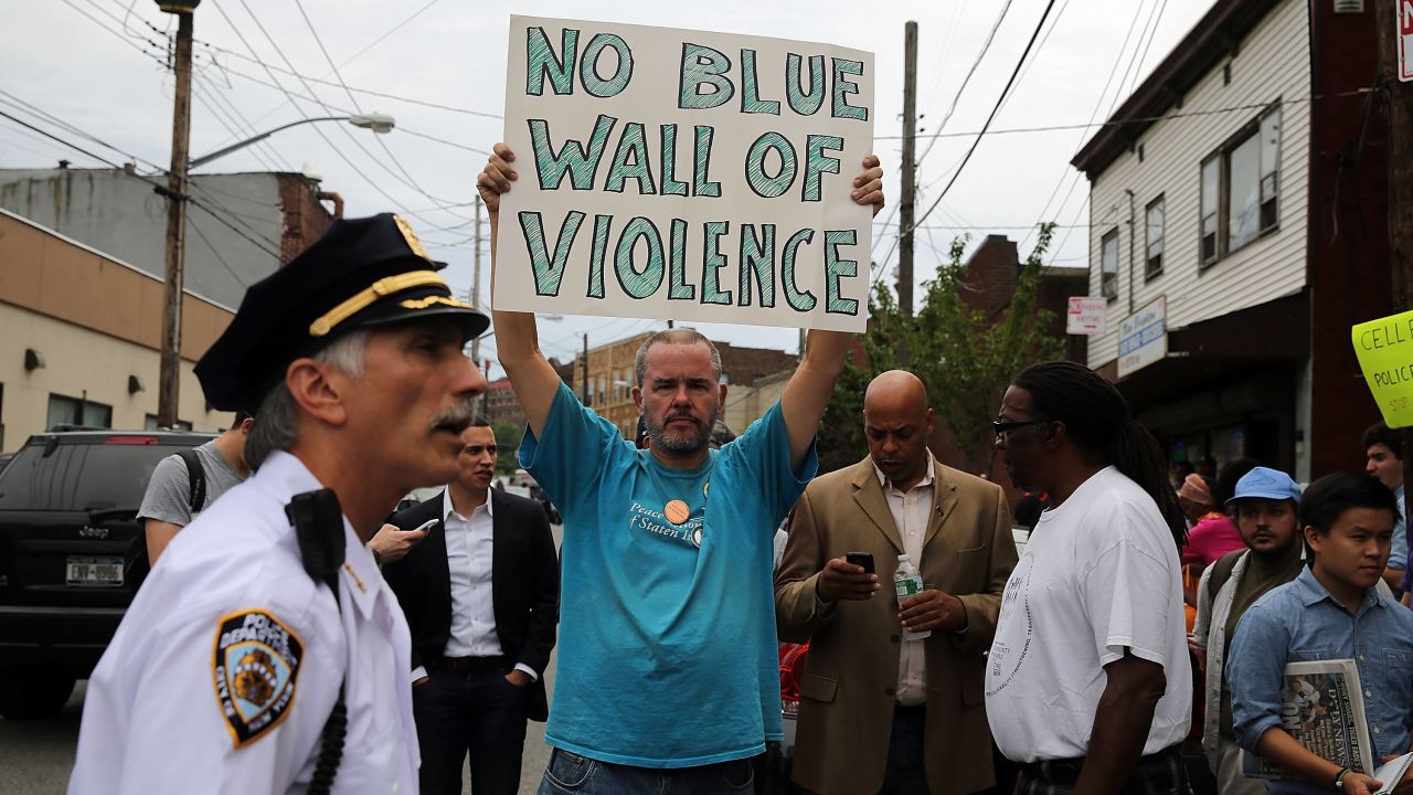 People participate in a demonstration against the death of Eric Garner after he was taken into police custody in Staten Island.
