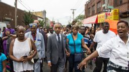 People participate in a demonstration against the death of Eric Garner after he was taken into police custody in Staten Island. Joel Graham photographed the demonstration, and captured this image of Garner's friends and family ralling alongside Rev. Al Sharpton.