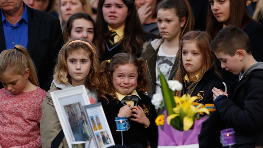 Mourners attend a memorial service held for a family of five killed in the flight MH17 disaster, in the suburb of Eynesbury on July 20, 2014 in Melbourne, Australia.