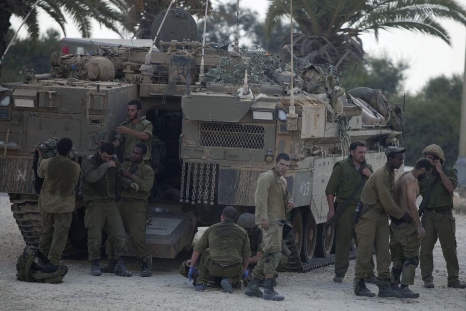 Israeli soldiers give medical care to soldiers who were wounded during an offensive in Gaza on July 20.