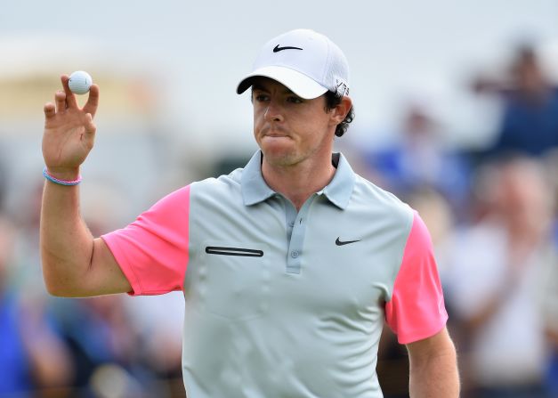 Rory McIlroy acknowledges the gallery after holing a crucial birdie putt on the ninth on the way to his British Open triumph.