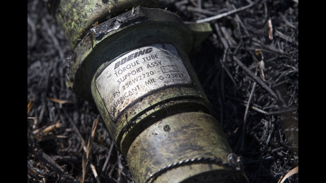 A piece of the plane lies in the grass in eastern Ukraine's Donetsk region on July 21, 2014.