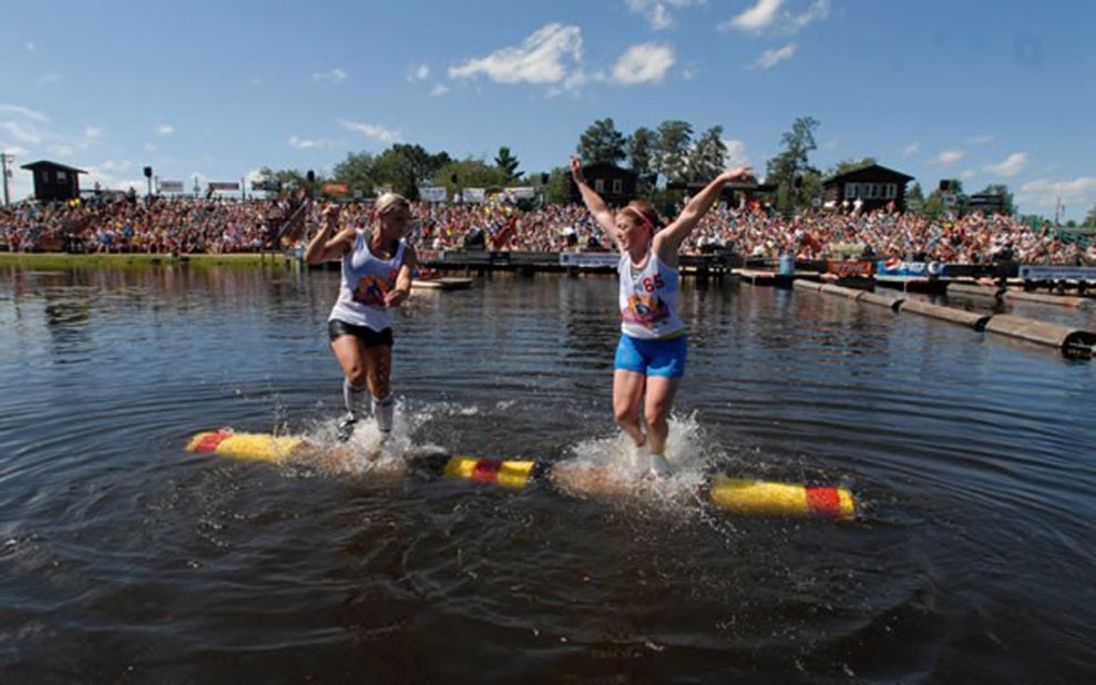 Verstegen, left, competes in the logrolling event at the Lumberjack World Championship in 2011. Using foot maneuvers and endurance, the athletes try to dislodge their opponent into the water.