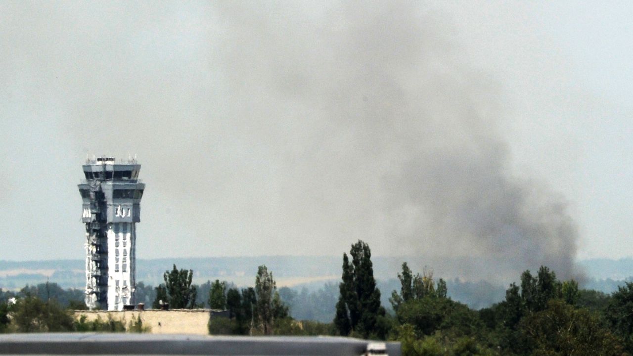 Smoke rises near the airport traffic control tower in Donetsk, eastern Ukraine on Monday.