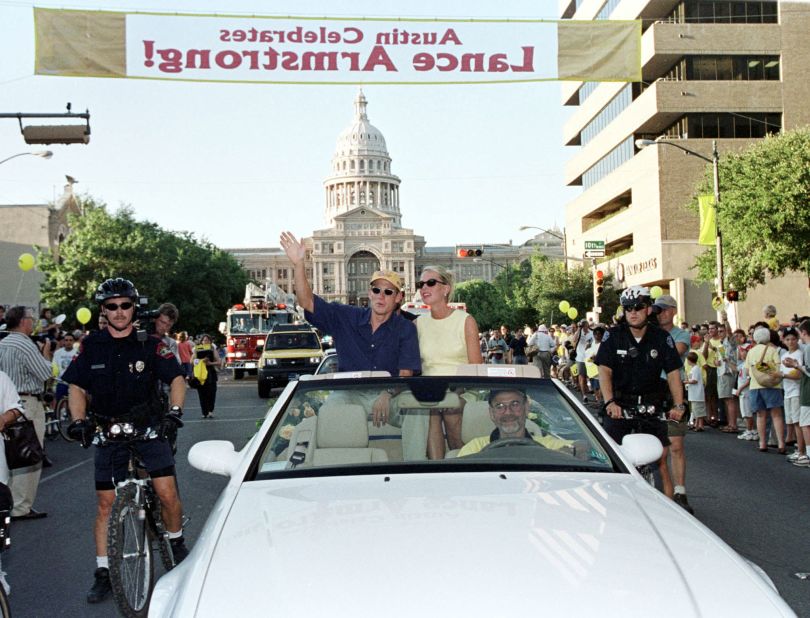 Armstrong waves during a parade in his honor in 1999.