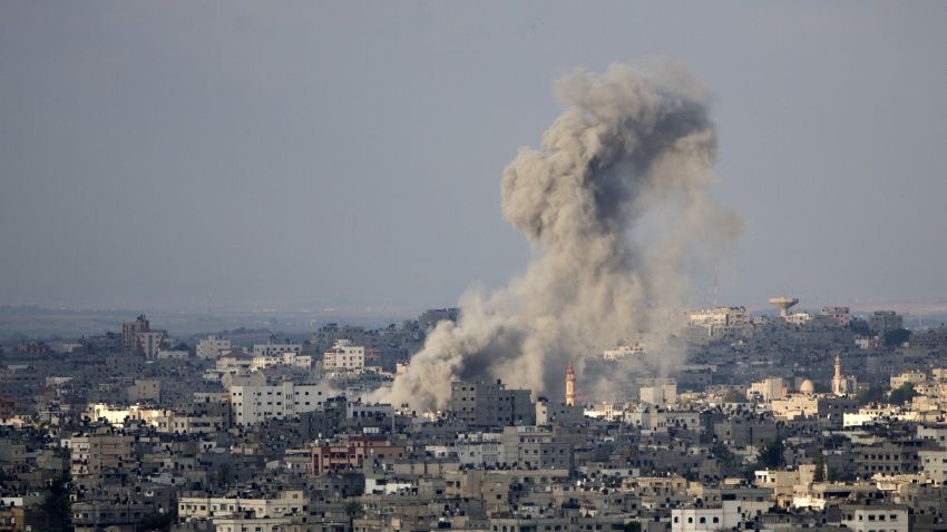 Smoke rises after an Israeli missile strike on Gaza City, on July 19, 2014. Israel's operation against Hamas saw one of its bloodiest days with 46 Palestinians killed in Gaza and two Israeli soldiers dying in a clash with militants who infiltrated he Jewish state.  As Israeli warplanes bombarded Gaza from the air, and ground troops pressed an assault on land, the Palestinian death toll rose to 342, with rights groups warning that a growing number of victims are children. AFP PHOTO / MAHMUD HAMS        (Photo credit should read MAHMUD HAMS/AFP/Getty Images)