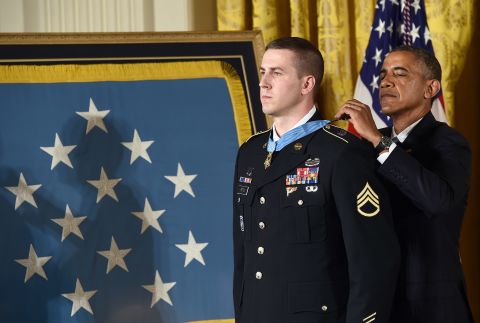 Former U.S. Army Staff Sgt. Ryan J. Pitts receives the Medal of Honor in July for his actions during a battle in Afghanistan in 2008. According to the Army, Pitts launched grenade after grenade under a hail of enemy gunfire as comrades at other nearby posts fell. He also asked other soldiers to fire at his position to prevent the enemy from gaining ground.