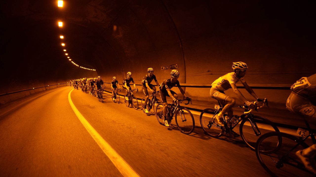 Italian cyclist Vincenzo Nibali, second from right, rides in the pack during the 14th stage of the Tour de France on Saturday, July 19. He finished second in the 110-mile stage but retained the yellow jersey as overall leader.