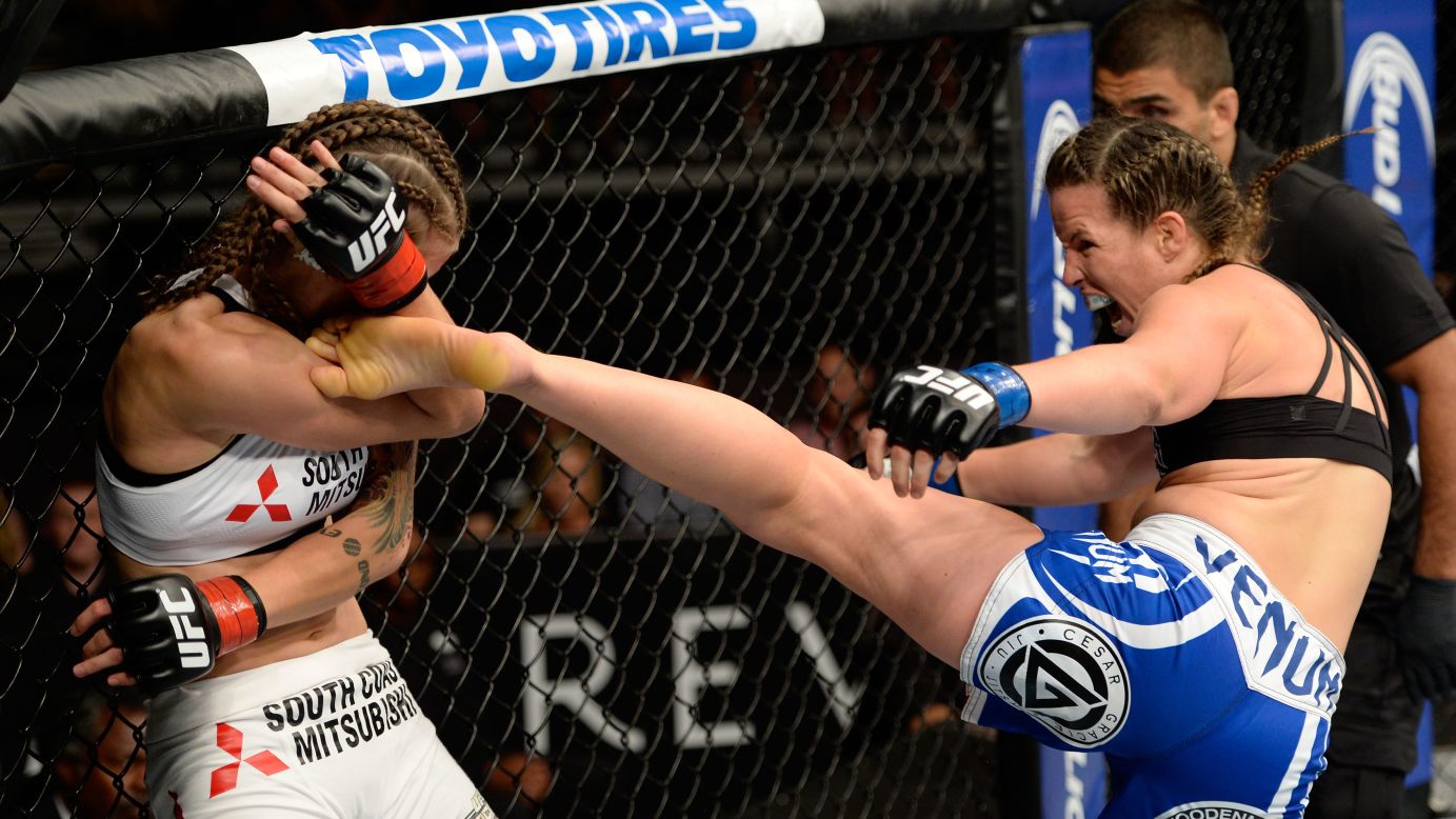 Leslie Smith kicks Jessamyn Duke in their UFC bantamweight bout Wednesday, July 16, in Atlantic City, New Jersey. Smith won by a first-round technical knockout.
