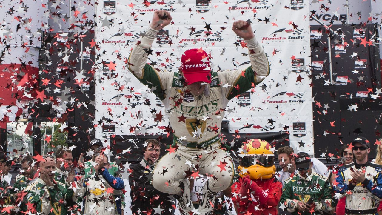 IndyCar driver Mike Conway leaps out of his car after winning a race in Toronto on Sunday, July 20. It was his second win of the season, which started March 30 and ends August 30.