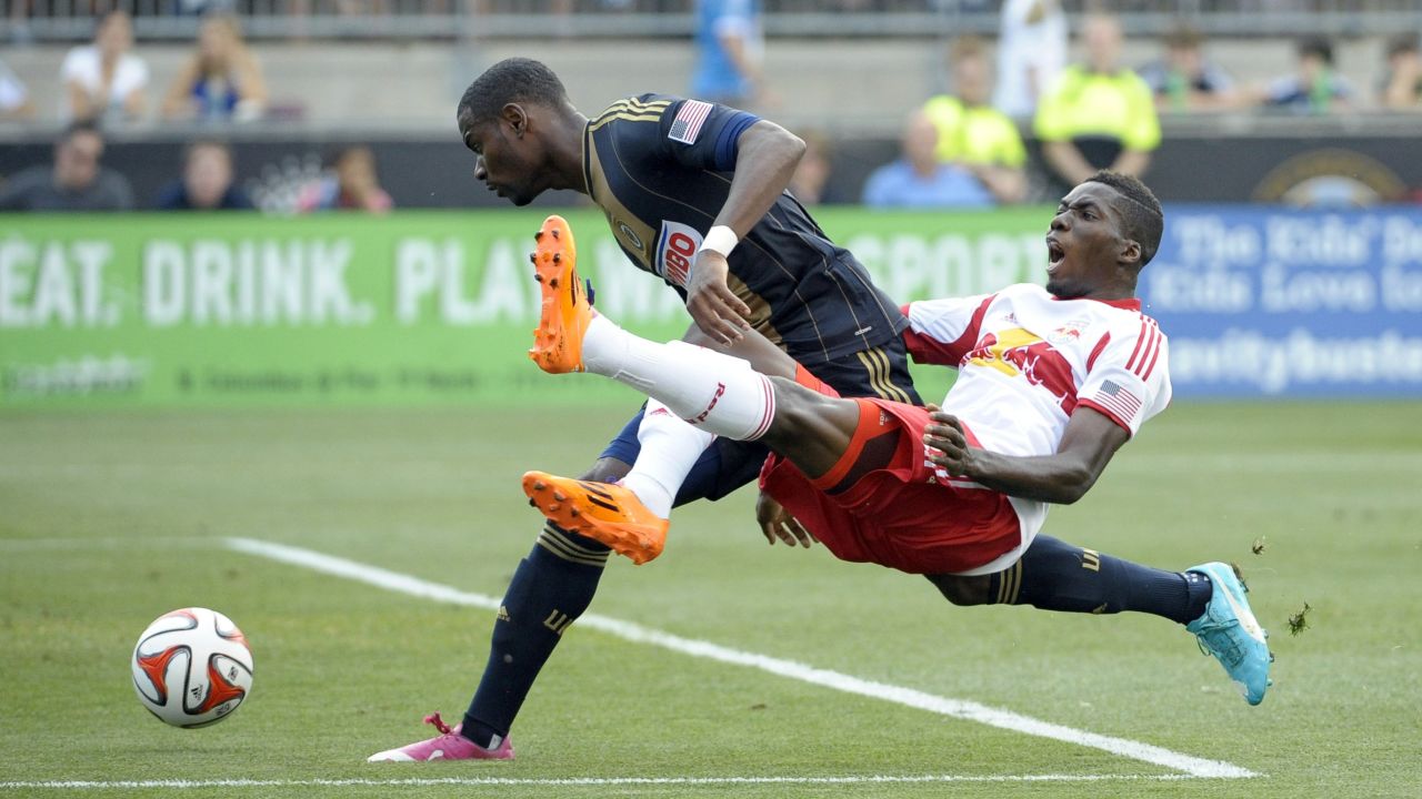 Philadelphia Union midfielder Maurice Edu, left, competes with New York Red Bulls defender Ambroise Oyongo during a Major League Soccer game Wednesday, July 16, in Philadelphia.