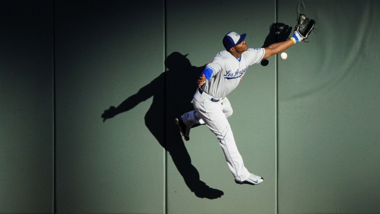 Los Angeles Dodgers outfielder Yasiel Puig is unable to catch a ball hit by Mike Trout during the Major League Baseball All-Star Game on Tuesday, July 15. Trout's triple helped him win the game's Most Valuable Player award as the American League triumphed 5-3.