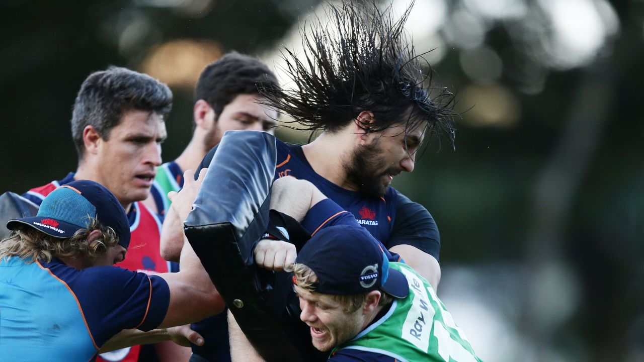 Rugby player Jacques Potgieter of the New South Wales Waratahs is tackled during a training session Monday, July 21, in Sydney.