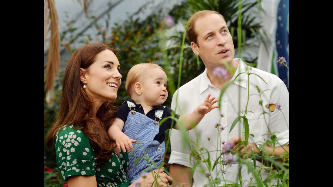 Britain's Prince George and his parents, Prince William and Duchess Catherine, visit a butterfly exhibition at London's Natural History Museum on July 2. Prince George celebrates his first birthday on Tuesday, July 22.