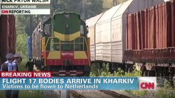 MH17 bodies arrive in Kharkiv Walsh earlystart_00011110.jpg