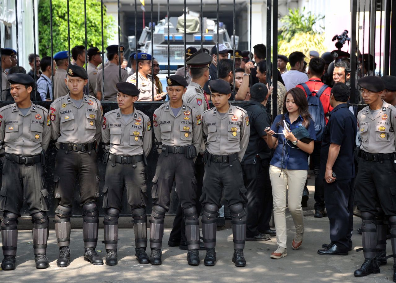 Indonesian police secure the area around the General Elections Commission building in Jakarta on prior to the election count announcement. The presidential election was held July 9.