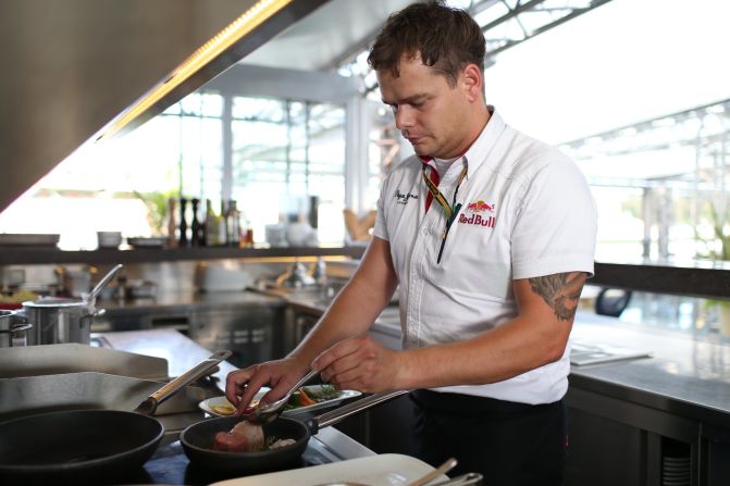 Red Bull Racing executive chef Sandro Gamsjager, seen here in the roof top kitchen of the team's motor home, says he cooks up to 2,500 meals for the team and guests over a grand prix weekend.