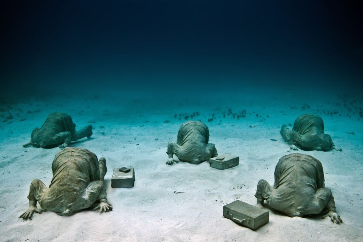 <em>Bankers</em><br /><br />The artist doesn't shy away from a strong metaphor, such as the installation shown above where figures have their heads literally buried in sand: "This was a piece referencing climate change and global warming, and how we tend to be living in denial at the moment, forgetting the future for short term gain," says Taylor, "Caribbean has lost  so much of its natural reef, I think it really is a critical situation."