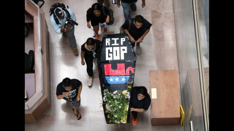 Activists from the group United We Dream stage a mock funeral service for the Republican Party during a protest in Washington on July 21. They staged the funeral, they said, because "the GOP has embraced radical right-wing policies and has actively called for the separation of families and the deportation of Dreamers."