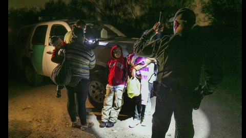 Mothers and children from Honduras prepare to get into a customs agent's truck after crossing the Rio Grande into Texas.