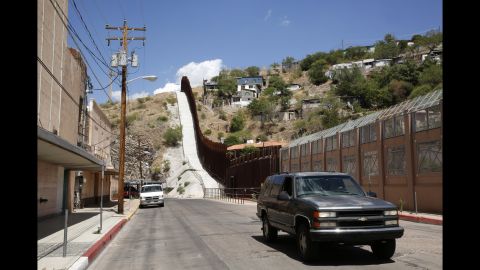 A steel border fence separates Nogales, Arizona, from its sister city in Sonora, Mexico. Nogales is Arizona's largest international border town and an entry point for goods and people from Mexico.