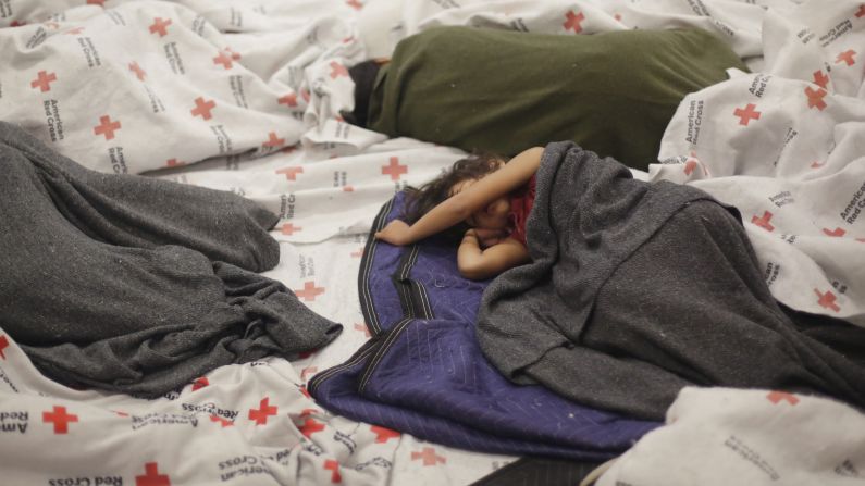 Detainees sleep in a holding cell June 18 at a U.S. Customs and Border Protection processing facility in Brownsville, Texas.