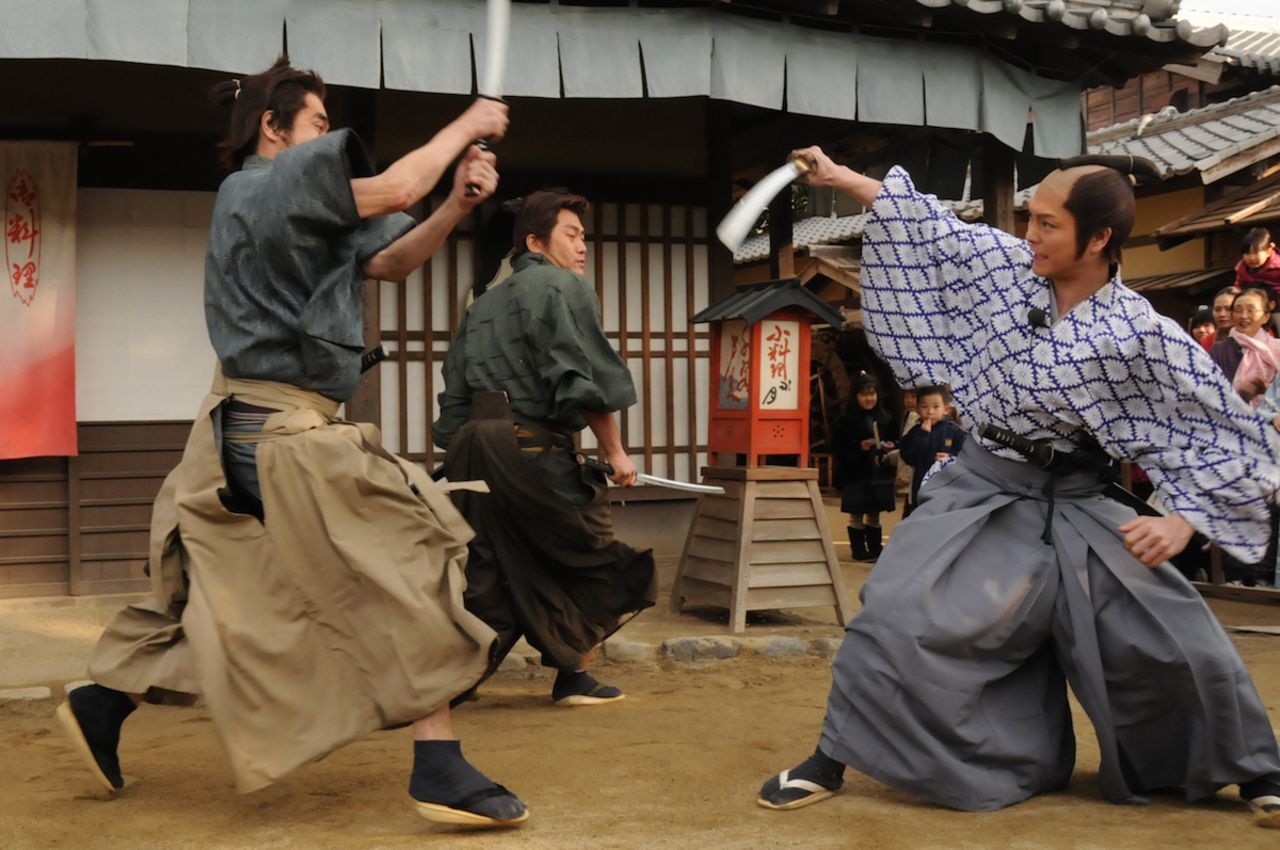 During Toei Kyoto Studio Park's samurai sword fighting demonstrations, audience volunteers are invited to learn a few moves from the actors.