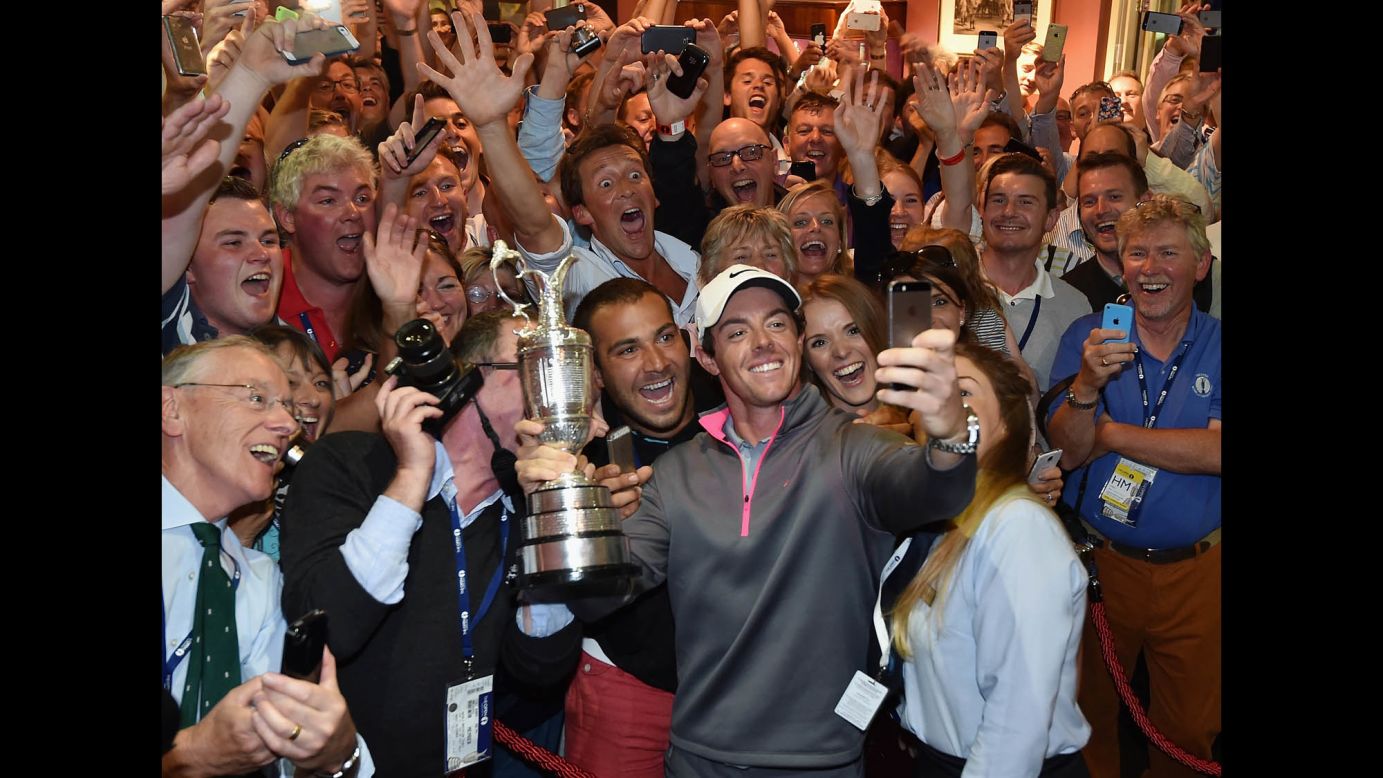 Golfer Rory McIlroy takes a selfie with the Claret Jug and members of the Royal Liverpool Golf Club after he won the British Open on Sunday, July 20. It was the third major victory of McIlroy's career, and he only needs to win the Masters now to complete the career "Grand Slam."